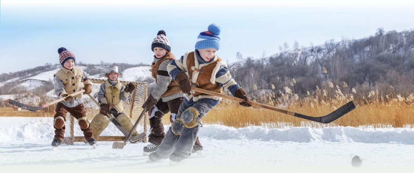 Children of the local community playing Hockey with healthy teeth